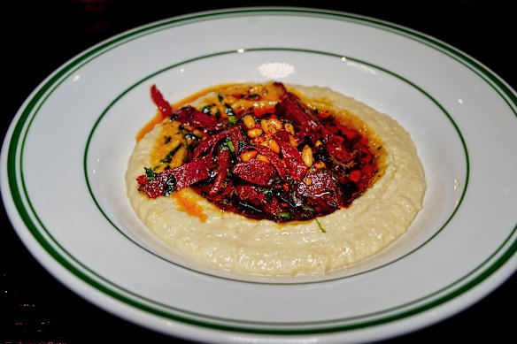  Chickpea dip topped with cured beef, pine nuts, butter and parsley.