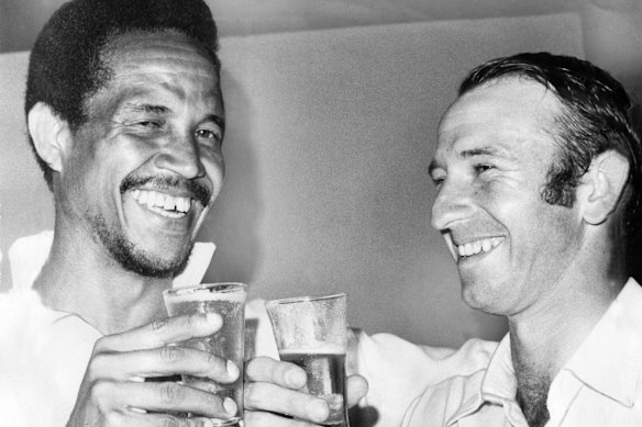 World XI captain Garry Sobers (254) and Australia’s Doug Walters (127) celebrate their big scores in 1972. Tributes have poured in for Sobers after his death aged 89.