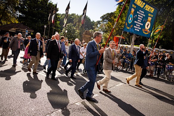 Veterans and their supporters march down Elizabeth Street in Sydney.