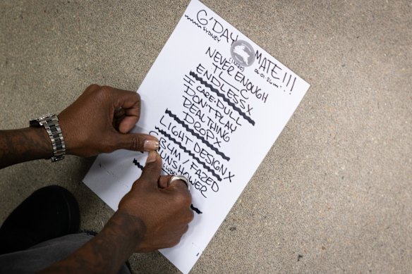 The band prep their setlist, complete with a nod to the Rabbitohs, backstage.