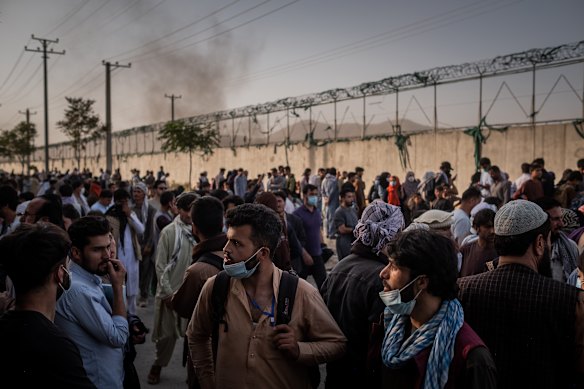 People gathered outside the international airport in Kabul on August 25, 2021. 