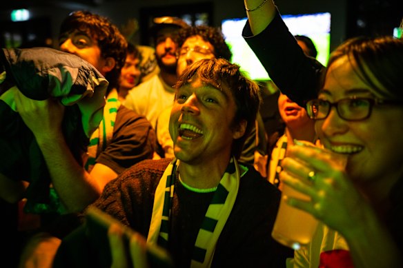 Fans cheer as the Socceroos play the United States.