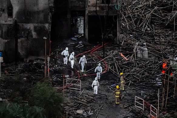 Hong Kong’s Disaster Victims Identification Unit at the site after the fire at the Wang Fuk Court residential estate.