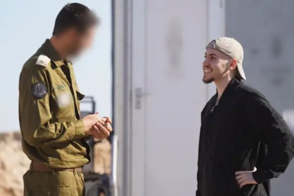 A grinning Eitan Mor meets with IDF personnel after more than 735 days in captivity.