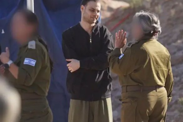 Released hostage Alon Ohel with Israeli forces following his release.