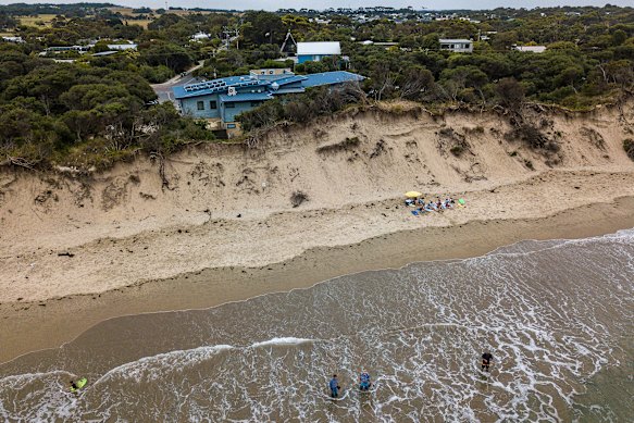 Inverloch surf club on the Victorian Bass Coast – with homes visible behind – in 2019, before it was sandbagged to safeguard it from dune erosion.