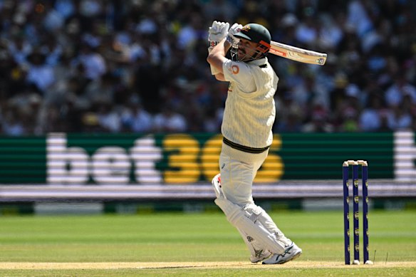 Travis Head in action during the Boxing Day Test at the MCG, with Bet365 advertising in the background.