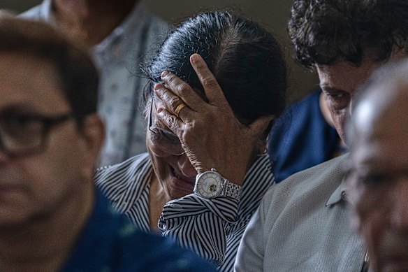 The mother of Clive Kunder, co-pilot of the Air India flight that crashed last month, mourns during a prayer meeting for the Air India crew in Mumbai on Saturday.