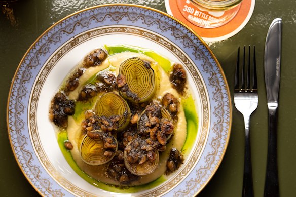 Butter-poached leeks with truffle-hazelnut pesto.