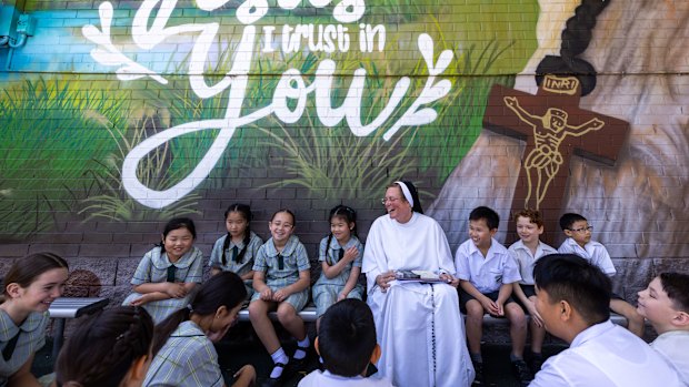 Sister Cecelia with students at the St Peter Chanel Primary School in Regents Park.