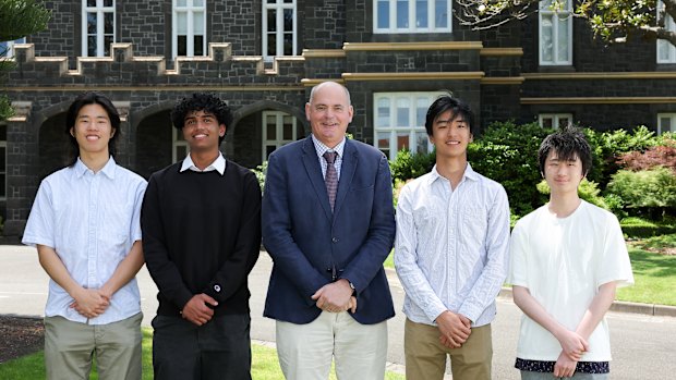 Five Melbourne Grammar School students received ATAR scores of 99.95. From left are Nicholas Wang, Tahj Kumar, headmaster Philip Grutzner, Daniel Gao and Andison Zhang. The fifth student was Georgios Pirpiris.