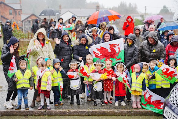Locals in the Welsh village of Newtown await the arrival of the William, Prince of Wales, and Catherine, Princess of Wales, ahead of St David’s Day celebrations on Wednesday.