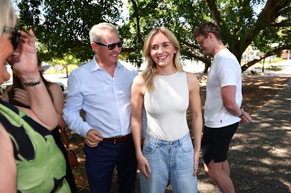 Ariarne Titmus with family members in Brisbane on Friday.