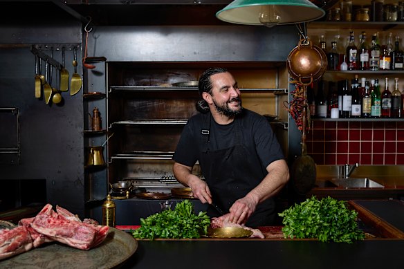 Zareh owner-chef Tom Sarafian in front of the hearth at his debut restaurant.