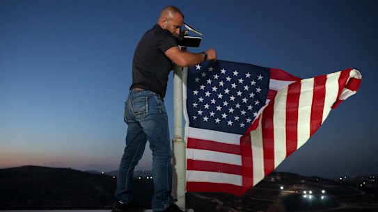 Entering his house around sunset, Palestinian-American Loui Ridi went to the roof and raised a US flag.