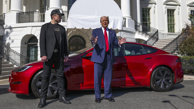 Donald Trump (right) said he would buy a Tesla in a show of support for the electric car-marker led by Elon Musk (left).