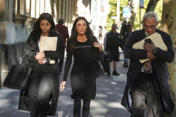 Sarah Tricarico (centre) outside court.