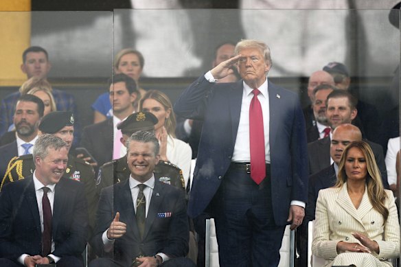 US President Donald Trump salutes during a military parade commemorating the US army’s 250th anniversary.