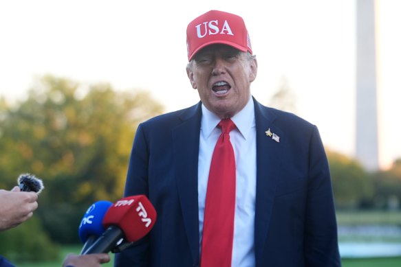 US President Donald Trump speaks to reporters on Sunday. 