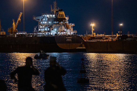 A cargo ship sits anchored at port in Oman amid Iran’s blockade of the Strait of Hormuz.
