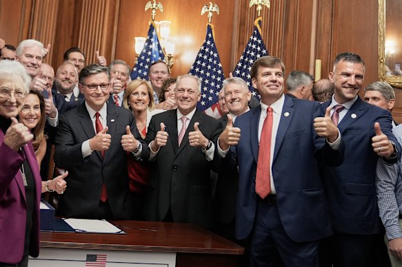 House Republicans join Speaker Mike Johnson to celebrate signing Trump’s bill.