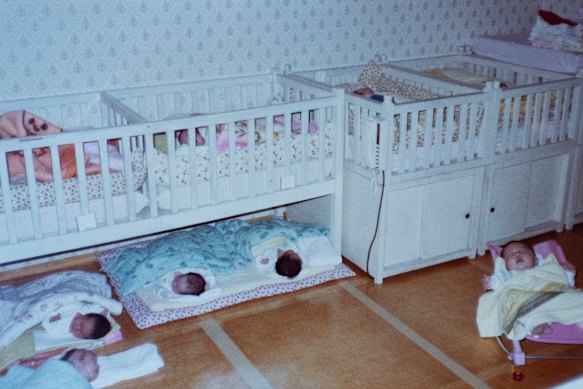 Rows of babies waiting for overseas adoption in 1984 at a South Korean orphanage.