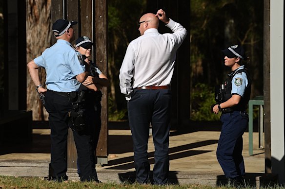 Detectives and officers at the site of the stabbing in Rouse Hill.