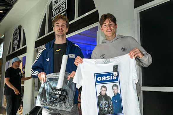 Friends Blaise O’Brien and Ethan Burne stocked up on merchandise before the Oasis concert. 