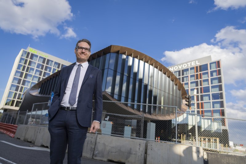 Shaped like a wing: Accor’s Adrian Williams in front of the Aerofoil co-working hub and the new hotels.