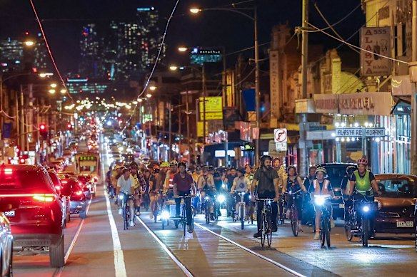 Cyclists ride through Brunswick to advocate for safer bike lanes.