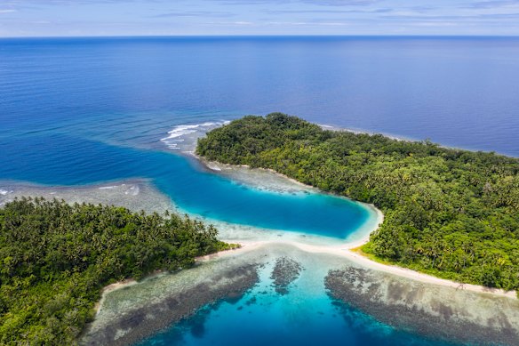 What is the world’s largest island that is shared by multiple countries?