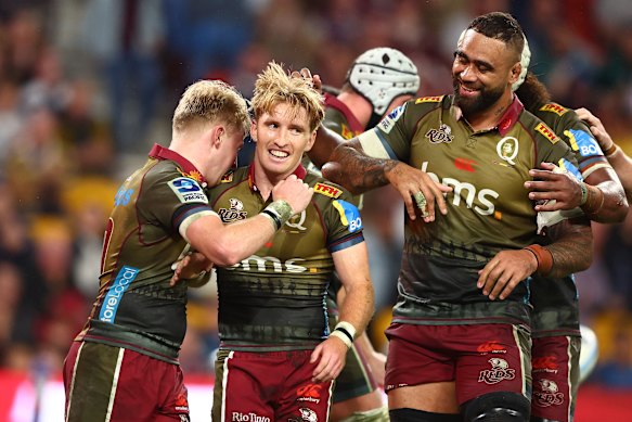 Tate McDermott of the Reds celebrates a try during the round 11 Super Rugby Pacific match between Queensland Reds and Blues at Suncorp Stadium.