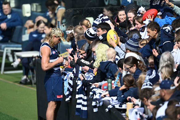 Bailey Smith signs autographs at Geelong training on Monday morning.