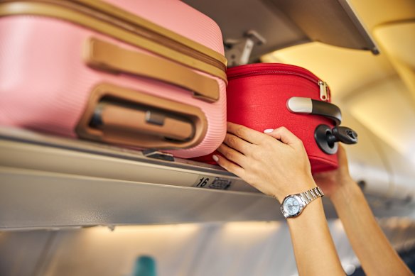If you need a fellow passenger to wrestle your luggage into the locker it really should have gone in the hold.