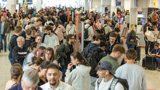 Passengers queuing at Melbourne Airport on Saturday after the Airbus warning.