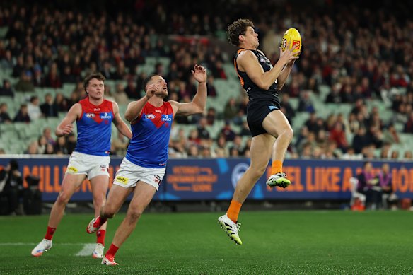 Charlie Curnow marks in front of Steven May on Saturday night.
