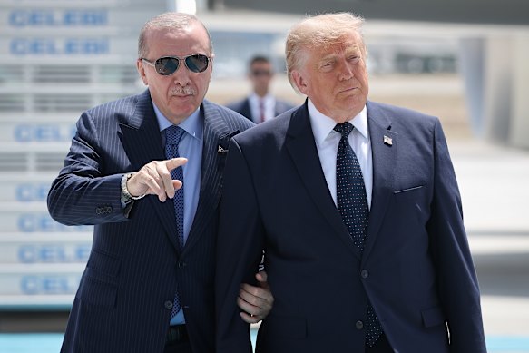 Donald Trump (right) was met by Turkish President Recep Tayyip Erdogan on Tuesday, as the US president arrived in Ankara for the annual NATO Summit.