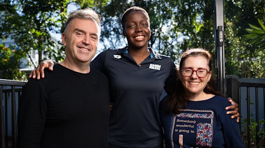 Commonwealth Games para-swimmer Victoria Belando Nicholson is photographed with her parents Ewan and Susana at their home in Brisbane.