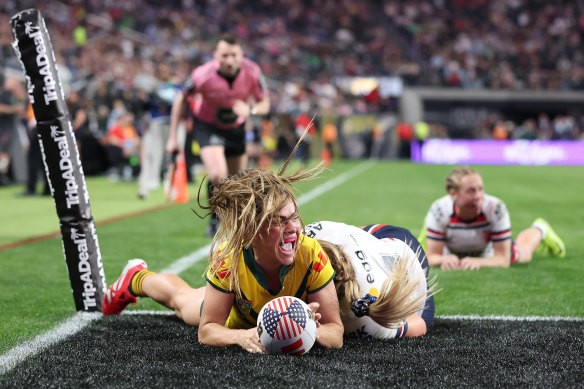 Jakiya Whitfield celebrates a try for Australia.