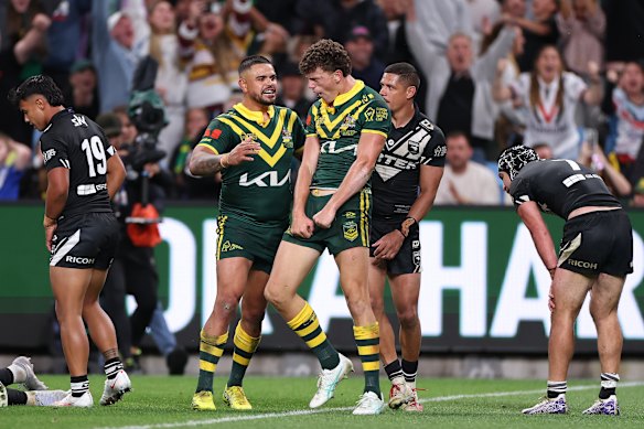  Jack Bostock celebrates with Latrell Mitchell.