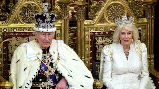 King Charles III and Queen Camilla smile during the King’s Speech in the House of Lord’s Chamber during the State Opening of Parliament on Wednesday.