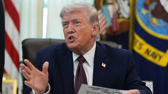 US President Donald Trump taking questions from reporters in the Oval Office on Tuesday.