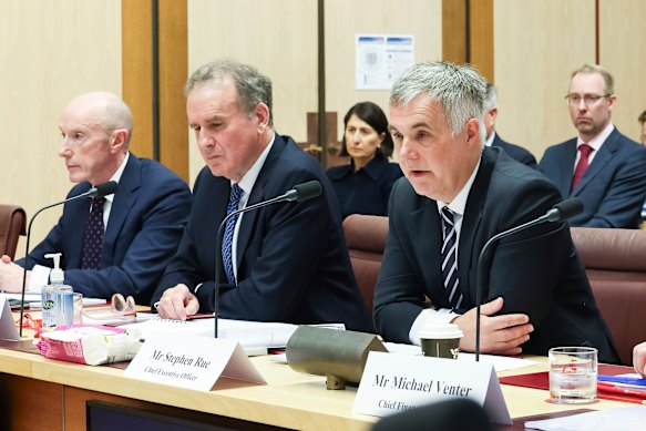 Optus CEO Stephen Rue (right) testified before senators in Canberra on Monday on the company’s Triple Zero failures along with chairman John Arthur (centre) and former chairman Paul O’Sullivan (left.)