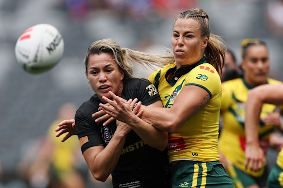 New Zealand’s Apii Nicholls is tackled by Australia’s Isabelle Kelly.