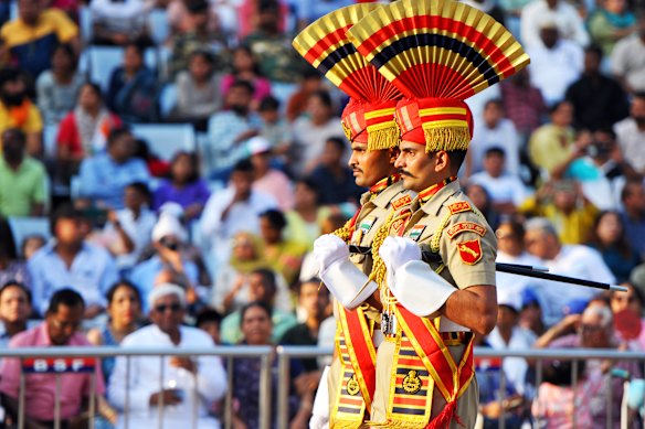 The elaborate daily ceremony at the Attari-Wagah border crossing is performed by the security forces of India and Pakistan.  