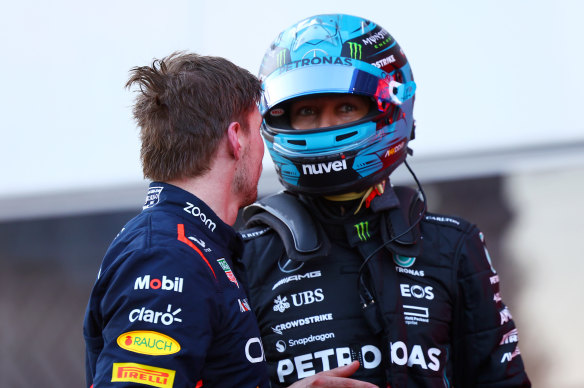 Max Verstappen and George Russell exchange words in parc ferme in 2023.