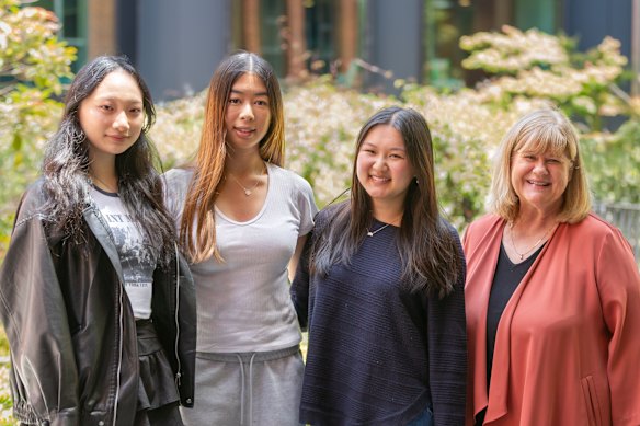 Camberwell Girls Grammar students Sunny Sun, Isabel Sootoh and Megan Chung with principal Debbie Dunwoody after receiving their results on Thursday.