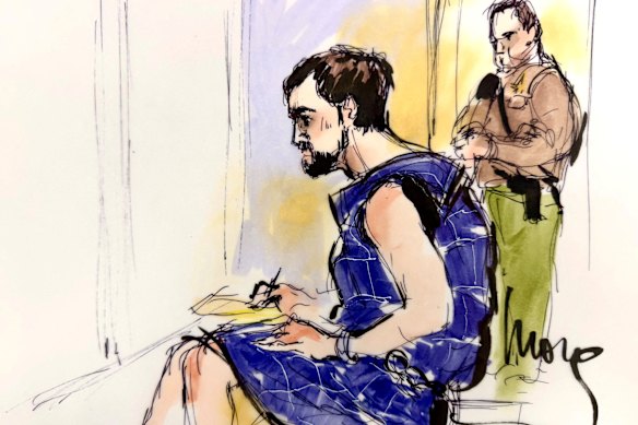 Nick Reiner, wearing a blue protective vest, has made his first court appearance on murder charges for the killing of his parents Rob and Michele Reiner, at Los Angeles Superior Court.