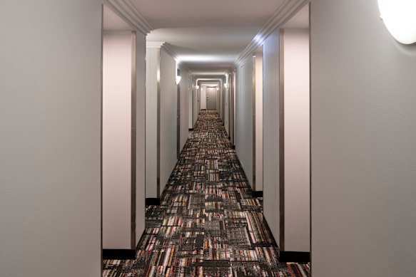 The carpet adds a touch of style to the otherwise bland corridors.