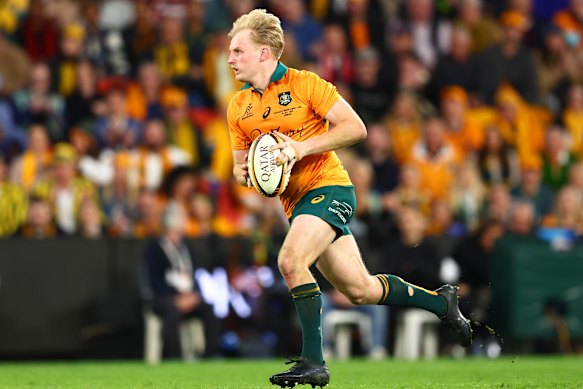 Tom Lynagh runs the ball back from a kick at Suncorp Stadium on this starting debut against the British and Irish Lions